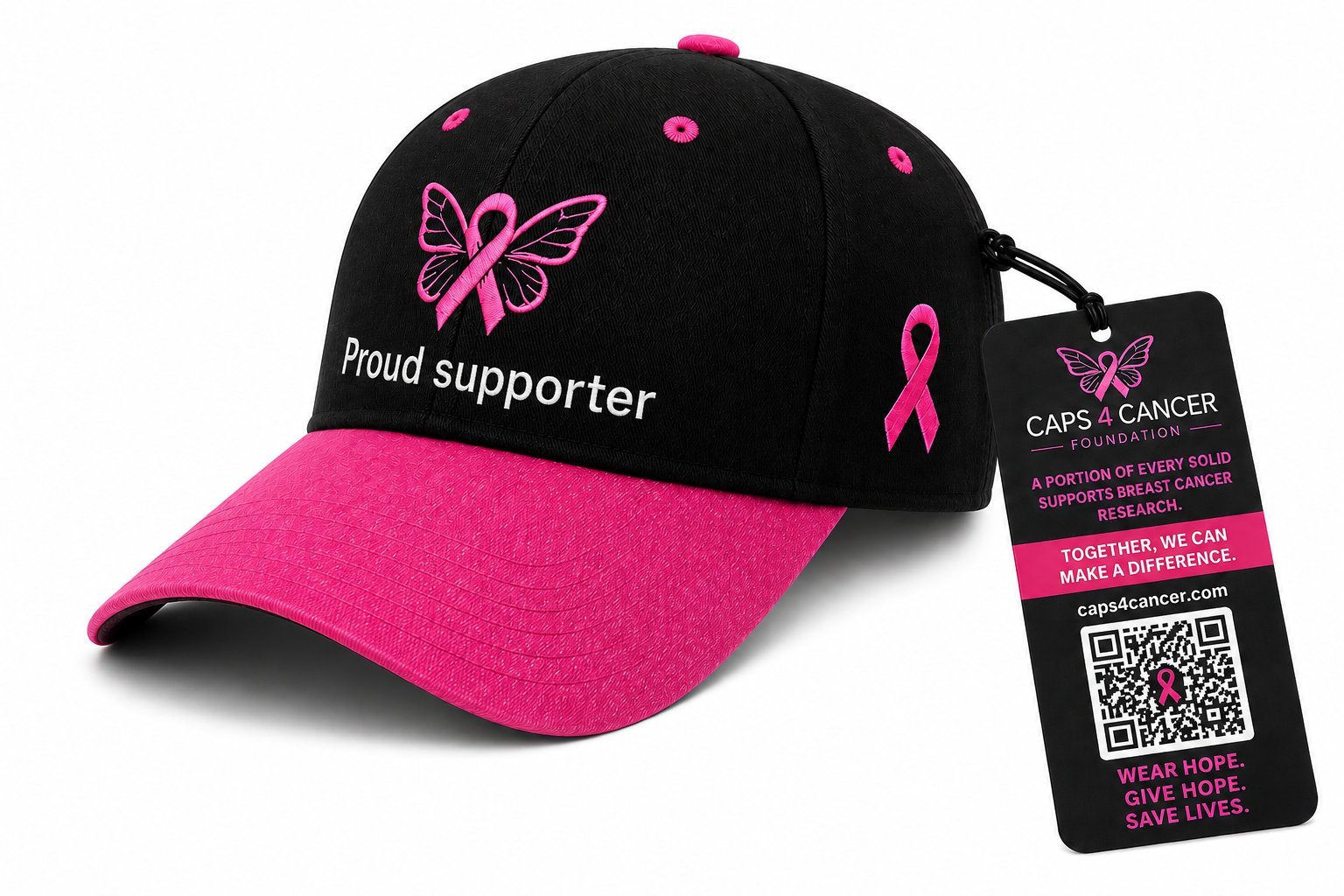 The official CAPS4CANCER cap — black crown, pink brim, embroidered ribbon logo, with its hang tag.